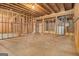 Spacious unfinished basement ready for customization, framing is clearly visible at 115 Edgewood Pkwy, Fayetteville, GA 30215