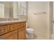Bright bathroom featuring a granite countertop vanity and tiled shower at 115 Edgewood Pkwy, Fayetteville, GA 30215