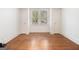 Bedroom features neutral paint colors, hardwood flooring and a window at 115 Edgewood Pkwy, Fayetteville, GA 30215
