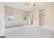 Bedroom with ensuite bathroom, carpet floors, large closet and additional built in shelving at 115 Edgewood Pkwy, Fayetteville, GA 30215