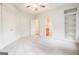 Bedroom with ensuite bathroom, carpet floors, large closet and additional built in shelving at 115 Edgewood Pkwy, Fayetteville, GA 30215