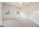 Bedroom featuring carpet floors, two windows with blinds, base molding, and closet at 115 Edgewood Pkwy, Fayetteville, GA 30215