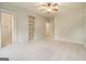 Bedroom with ensuite bathroom, carpet floors, large closet and additional built in shelving at 115 Edgewood Pkwy, Fayetteville, GA 30215