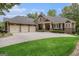 Charming home featuring a three-car garage, well-manicured lawn, and stone accents at 115 Edgewood Pkwy, Fayetteville, GA 30215