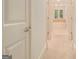 Hallway leading to bathroom with neutral carpet at 115 Edgewood Pkwy, Fayetteville, GA 30215