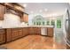 Spacious kitchen featuring stainless steel appliances, granite countertops and light fixtures at 115 Edgewood Pkwy, Fayetteville, GA 30215