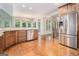 Kitchen with stainless steel appliances, custom cabinets, and breakfast nook at 115 Edgewood Pkwy, Fayetteville, GA 30215