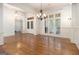 Spacious living room with hardwood floors, chandelier, and bright natural light at 115 Edgewood Pkwy, Fayetteville, GA 30215