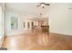 Open floor plan with living room, dining area, and kitchen featuring hardwood floors and lots of light at 115 Edgewood Pkwy, Fayetteville, GA 30215