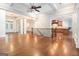 Open living room with coffered ceilings, hardwood floors, and staircase at 115 Edgewood Pkwy, Fayetteville, GA 30215