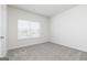A bedroom features neutral carpet, providing a cozy and comfortable space for rest and relaxation at 299 Limestone Circle, Conyers, GA 30013
