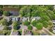 Aerial view of suburban neighborhood with mature trees, and pond, creating an inviting atmosphere for Gathering living at 3007 Brush Arbor Xing, Mcdonough, GA 30252