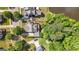 Eye-level aerial of an estate home with mature trees, large lot and a pond nearby at 3007 Brush Arbor Xing, Mcdonough, GA 30252