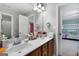 Bathroom featuring a double vanity, large mirror, and views into the room at 3007 Brush Arbor Xing, Mcdonough, GA 30252