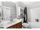 Bathroom featuring modern vanity, toilet, shower/tub combo, and medicine cabinet at 3007 Brush Arbor Xing, Mcdonough, GA 30252