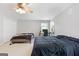 Large bedroom boasts two beds, neutral carpet, bright light, and a ceiling fan at 3007 Brush Arbor Xing, Mcdonough, GA 30252