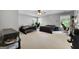 Spacious bedroom features two beds, neutral carpet, natural light, and ceiling fan at 3007 Brush Arbor Xing, Mcdonough, GA 30252