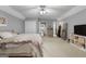 Neutral bedroom with a ceiling fan, plush carpet, and ample closet space at 3007 Brush Arbor Xing, Mcdonough, GA 30252