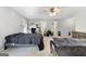 Bright bedroom with two beds, a ceiling fan, neutral carpet, and bright windows at 3007 Brush Arbor Xing, Mcdonough, GA 30252