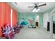 Bright bedroom with dinosaur wall decor, neutral carpet, and a ceiling fan at 3007 Brush Arbor Xing, Mcdonough, GA 30252