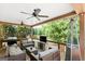 Spacious covered deck with comfortable seating, ceiling fans, and scenic views at 3007 Brush Arbor Xing, Mcdonough, GA 30252
