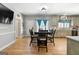 Open concept dining room offers a view into the kitchen area at 3007 Brush Arbor Xing, Mcdonough, GA 30252
