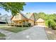 Home featuring a welcoming front porch, an attached garage, and well-maintained landscaping on a sunny day at 3007 Brush Arbor Xing, Mcdonough, GA 30252