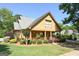 Inviting craftsman style home with a well-maintained lawn and a cozy covered front porch at 3007 Brush Arbor Xing, Mcdonough, GA 30252