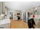 Spacious kitchen with stainless steel appliances, light wood cabinets, and hardwood floors throughout at 3007 Brush Arbor Xing, Mcdonough, GA 30252