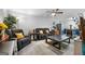 Living room featuring comfortable seating area and modern open kitchen design at 3007 Brush Arbor Xing, Mcdonough, GA 30252