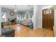 Cozy living room featuring hardwood floors, neutral paint, and bright, natural light at 3007 Brush Arbor Xing, Mcdonough, GA 30252