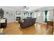 Comfortable living room with fireplace, hardwood floors, and ample seating at 3007 Brush Arbor Xing, Mcdonough, GA 30252