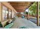 Covered patio with rocking chairs, ideal for relaxing and enjoying the outdoors at 3007 Brush Arbor Xing, Mcdonough, GA 30252