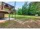Expansive backyard features a covered deck and patio area, perfect for outdoor entertaining and relaxation at 220 Drumcliff Ct, Tyrone, GA 30290