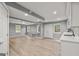 Finished basement showcasing tile floors, recessed lighting, and multiple windows for natural light at 220 Drumcliff Ct, Tyrone, GA 30290