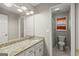 Bathroom featuring a granite countertop vanity and a toilet at 220 Drumcliff Ct, Tyrone, GA 30290