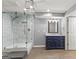 Remodeled bathroom featuring a glass-enclosed shower, modern vanity, and stylish fixtures at 220 Drumcliff Ct, Tyrone, GA 30290