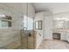 Tiled bathroom featuring walk-in shower, soaking tub, and granite countertop vanity at 220 Drumcliff Ct, Tyrone, GA 30290