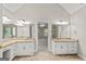 Bright bathroom features double vanity, tile flooring, and granite countertops at 220 Drumcliff Ct, Tyrone, GA 30290