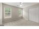 Bedroom features two windows and closet space at 220 Drumcliff Ct, Tyrone, GA 30290