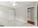 Bedroom with plush carpet, closet, and doorway leading to another room at 220 Drumcliff Ct, Tyrone, GA 30290