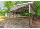 Spacious carport providing ample covered parking and protection from the elements at 220 Drumcliff Ct, Tyrone, GA 30290