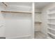 Walk-in closet with white shelving and wooden closet rods at 220 Drumcliff Ct, Tyrone, GA 30290