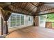 Spacious covered deck with ambient lighting, curtains, and adjacent windows and doors for convenient indoor-outdoor living at 220 Drumcliff Ct, Tyrone, GA 30290
