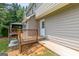 View of home's exterior, showcasing wooden deck, pathway, and gazebo, offering a seamless blend of indoor and outdoor living at 220 Drumcliff Ct, Tyrone, GA 30290