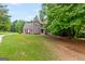 Charming home with a stone facade, well-manicured lawn, and inviting front entrance at 220 Drumcliff Ct, Tyrone, GA 30290