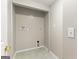 A simple laundry room with tile flooring and washer/dryer hookups at 220 Drumcliff Ct, Tyrone, GA 30290