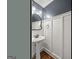 Charming powder room features wainscoting and pedestal sink at 220 Drumcliff Ct, Tyrone, GA 30290