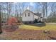 Manicured backyard with a lush lawn and mature trees surrounding the property at 595 S Antioch Rd, Mcdonough, GA 30252