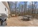 A spacious outdoor deck features a grill, lounge furniture and dining table with chairs at 595 S Antioch Rd, Mcdonough, GA 30252